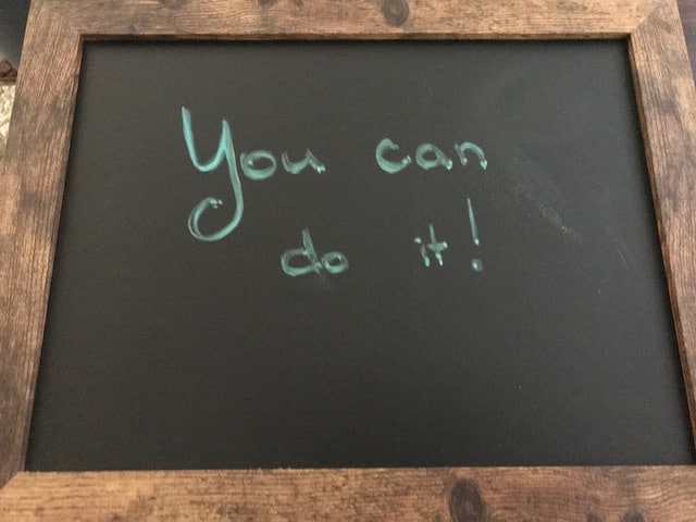 You can do it! (Message written on chalkboard sign.)